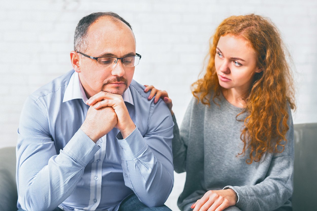 supportive-wife-comforting-her-upset-husband-at-me-2024-03-14-18-52-03-utc